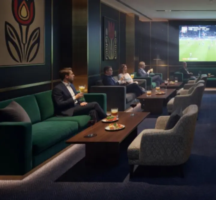 Sportnéző lounge nagy képernyőkkel és szurkoló vendégekkel a CDS Agnieszka Cichocka-Miłosz-ben